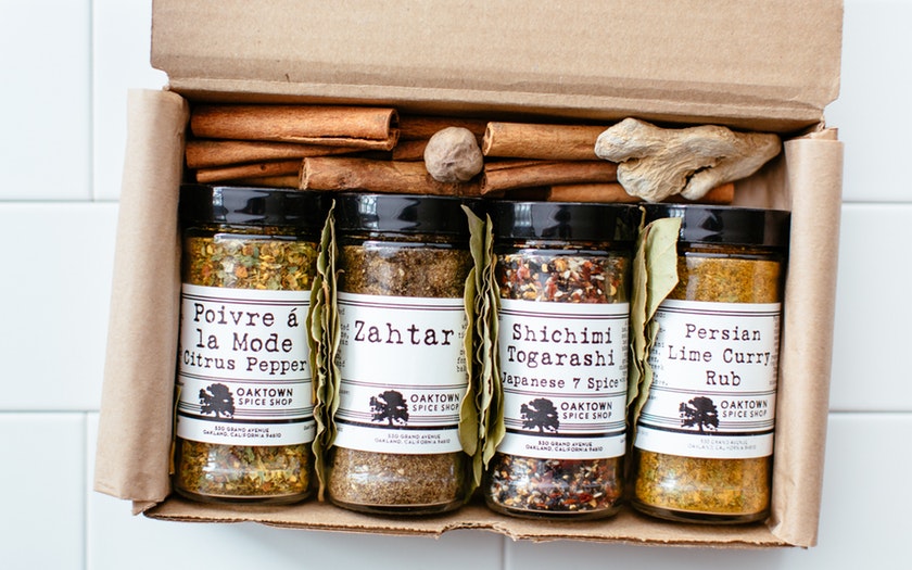 gift box with four different spices and sticks of cinnamon