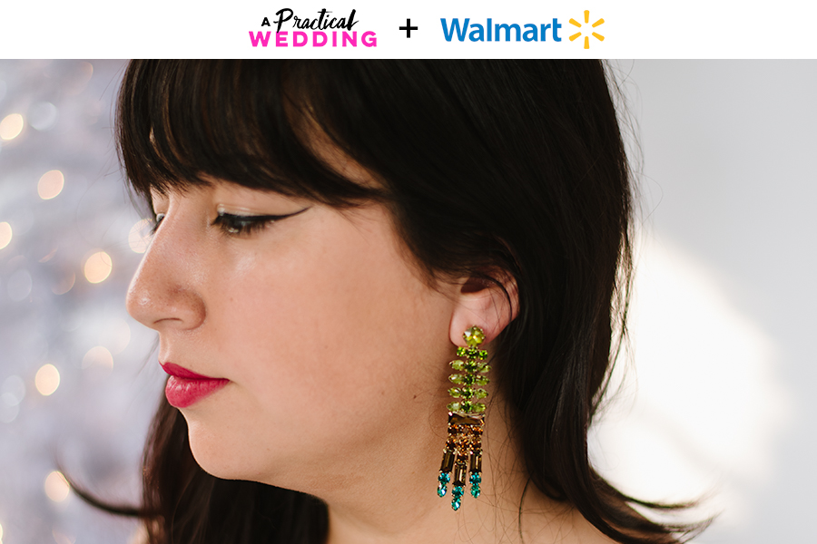 A woman with dark hair and bright lipstick looks to the side to show her multi-color beaded dangling earrings from Walmart.