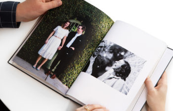 Two people looking through a wedding album