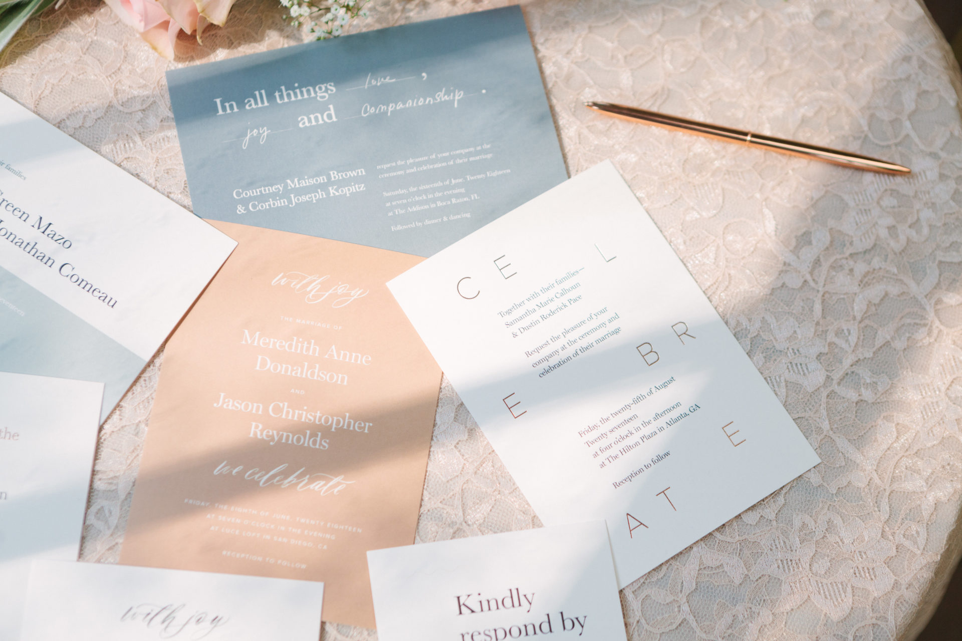 A wedding invitation suite from Artifact Uprising, spread on a table