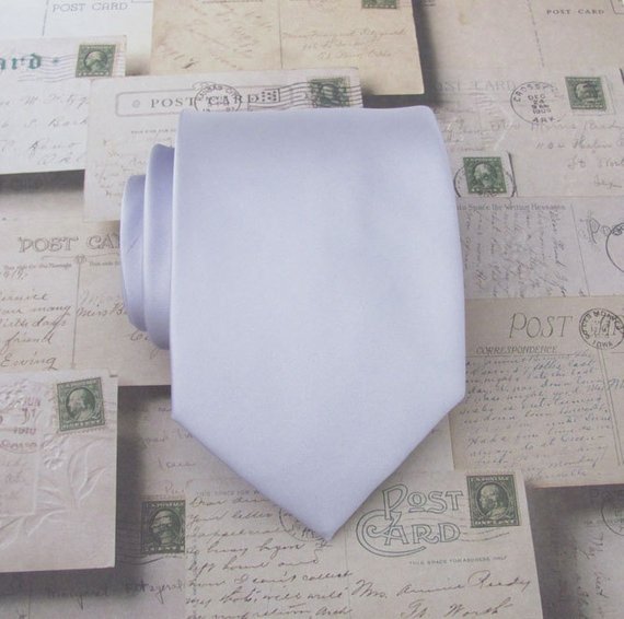 rolled up tie on vintage postcards in winter wedding colors: lavender