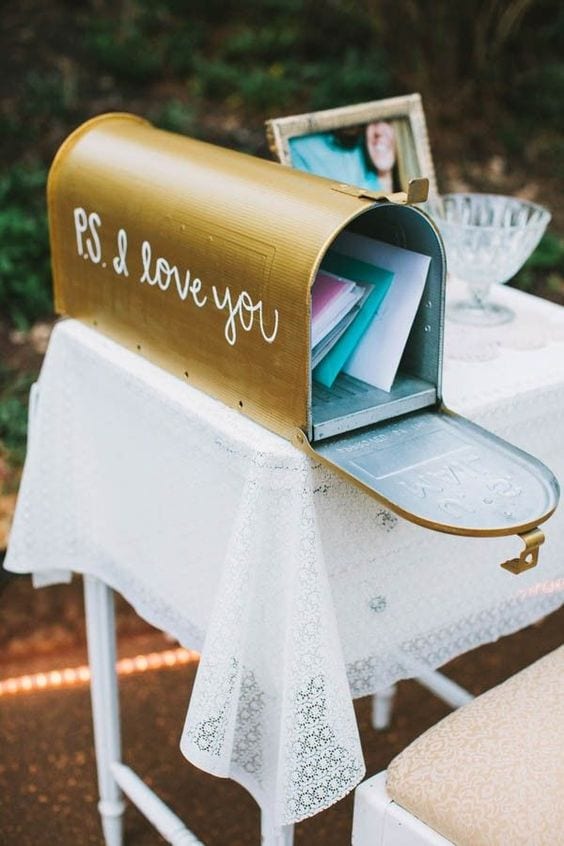 wedding ideas for a card box—a hand-painted golden mail box that reads "P.S. I love you" on the side in script handwriting