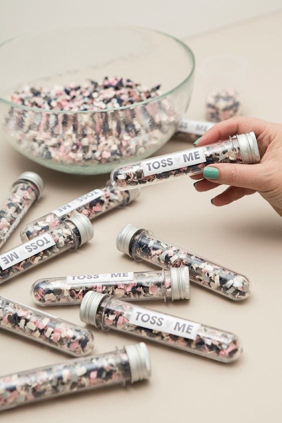 wedding ideas for confetti—individual filled tubes that read "Toss Me"