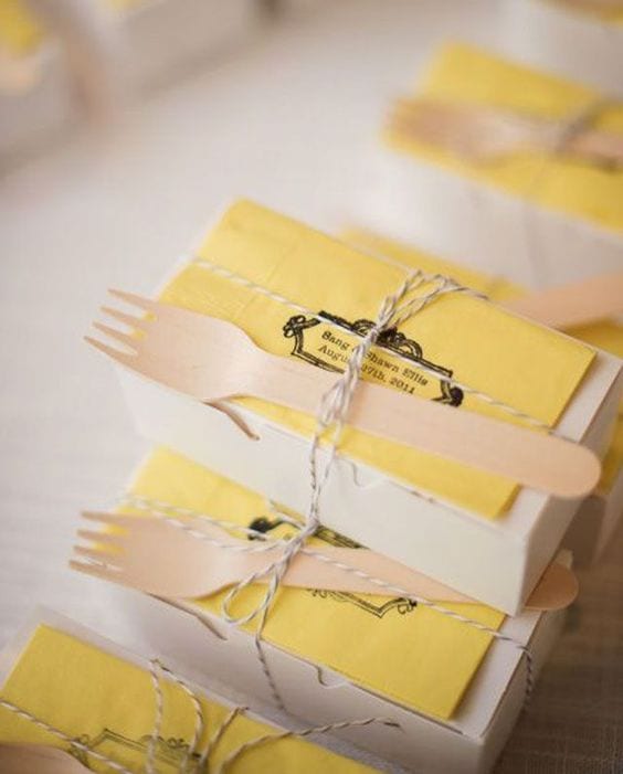 wedding ideas for dessert to go: cake to go box with a customized napkin with the names and date of the wedding, tied with butcher's twine with a wooden fork attached