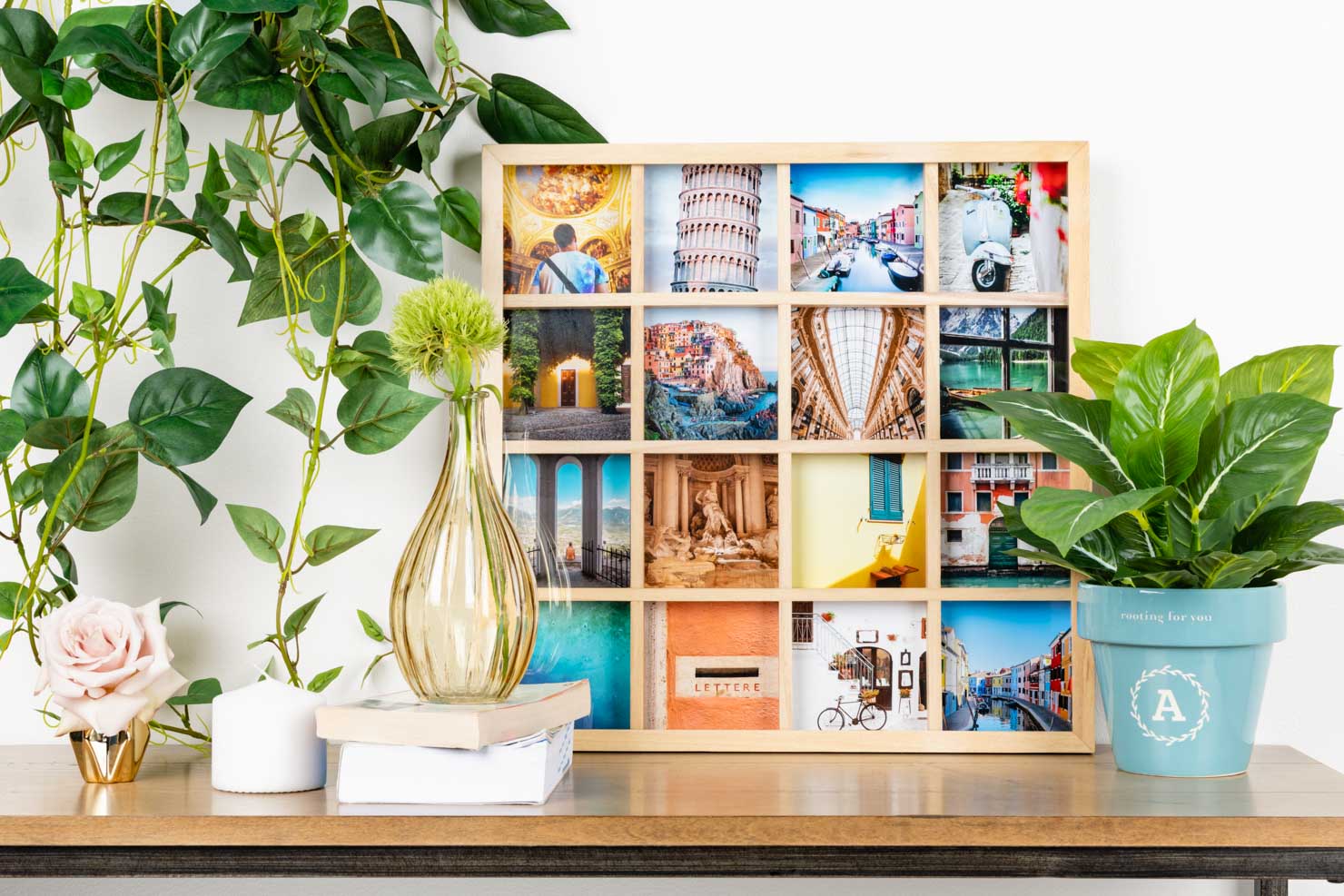 a 16-square picture frame on a shelf surrounded by vases and greenery