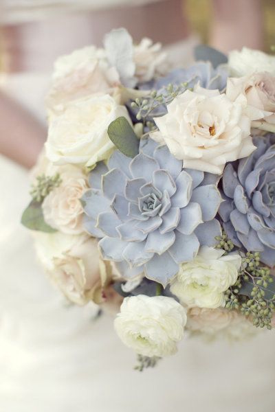 Succulent and rose bouquet closeup in blue-grey, cream, and sage winter wedding colors