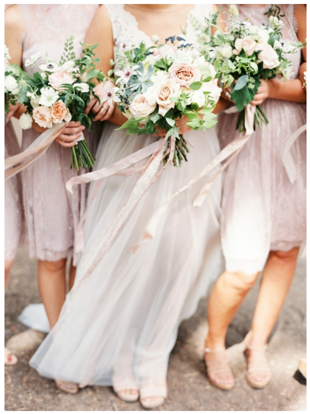 Bride and bridesmaids in cool pink and light blush winter wedding colors