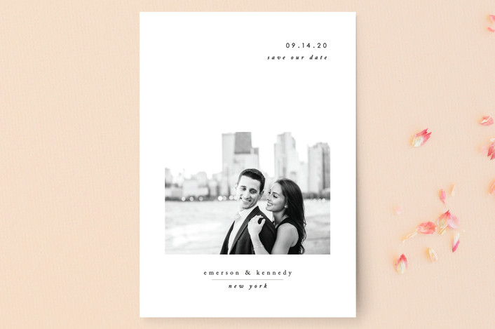 Minted save the date couple against a city background