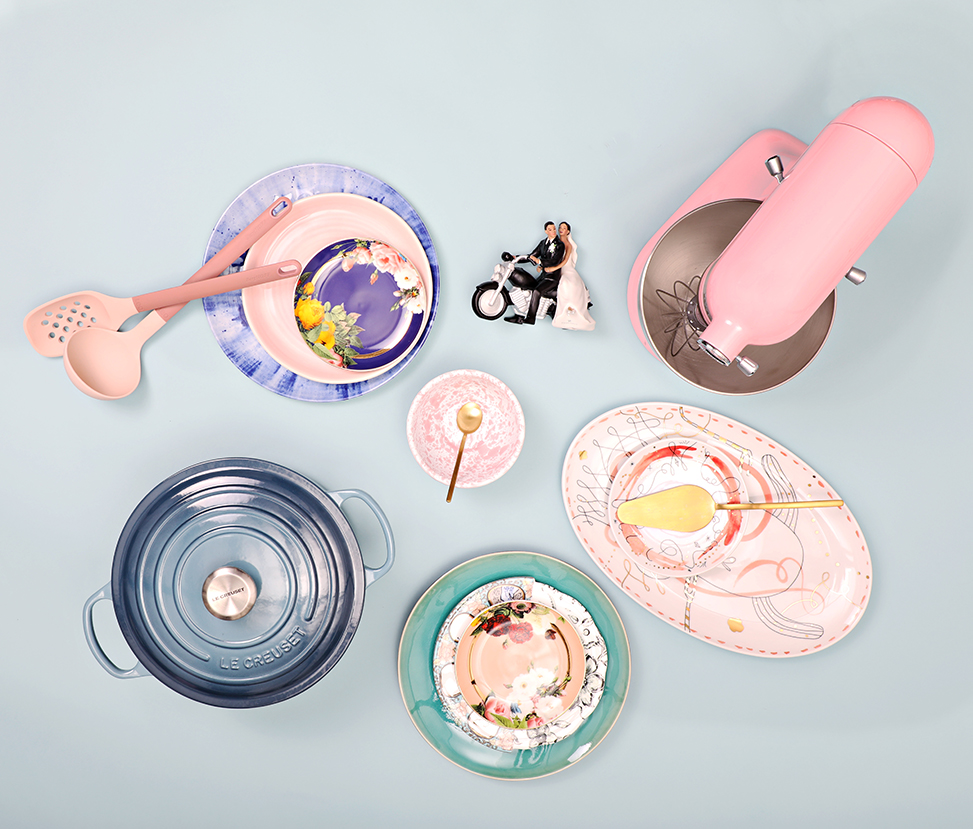 layflat zola registry photo featuring a le creuset dutch oven, a pink kitchenaid, and pink, turquoise and blue china