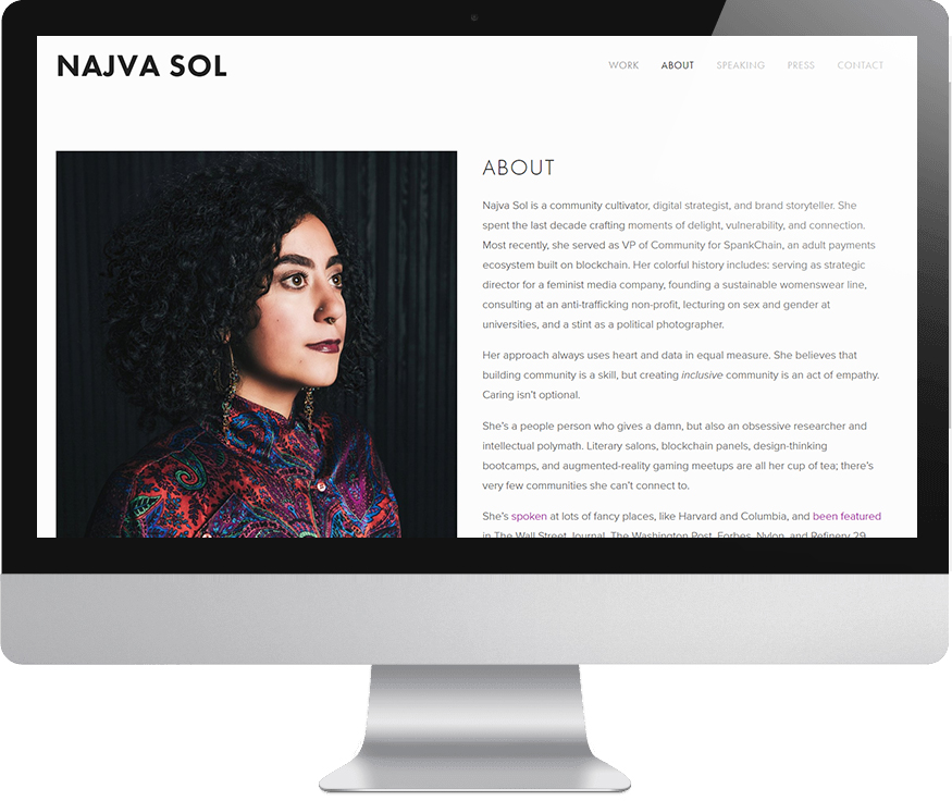 A computer monitor displaying the "About" page from Najva Sol's Squarespace website with a photo of Najva and descriptive text.