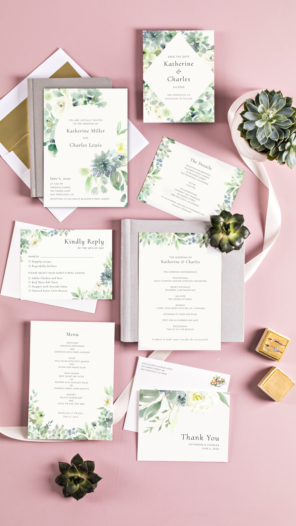 A watercolor botanical invitation suite from Zola on a pink table displayed with a ribbon and succulents