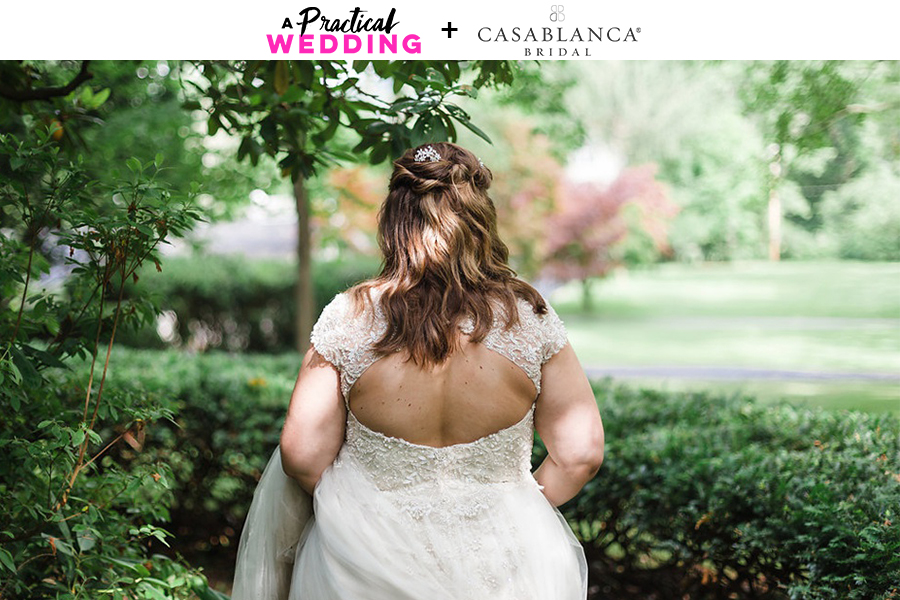 plus size bride wearing an open back lace wedding gown by casablanca bridal