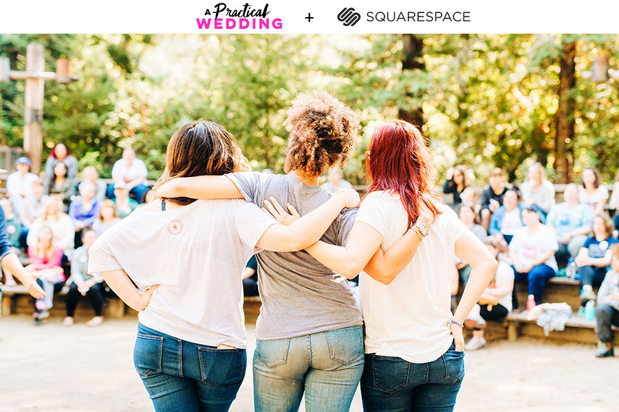 Three women in short sleeve tees and blue jeans stand with their arms around each other, looking out at a group of women gathered under trees sitting on benches. The text A Practical Wedding + Squarespace reads above.
