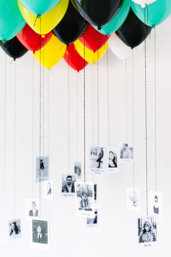 Bunch of colorful balloons with photos hanging from their strings as an engagement party idea