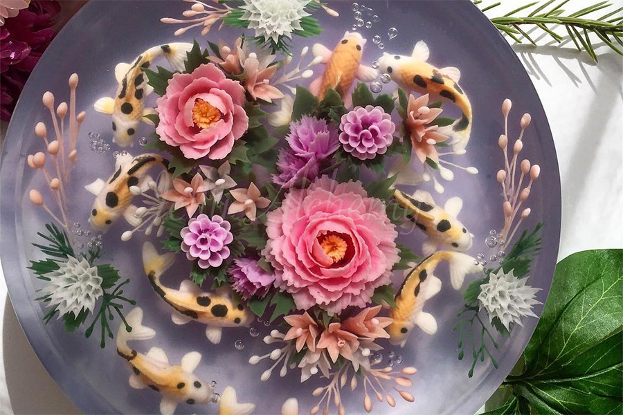 a jelly wedding cake designed to look like a fish pond with flowers
