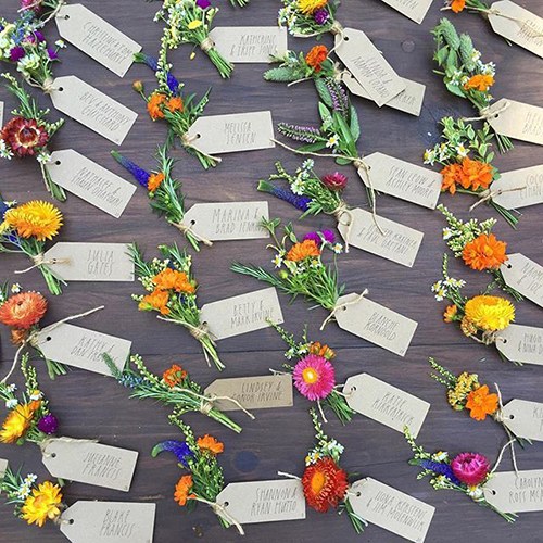 bouquets with escort cards on table