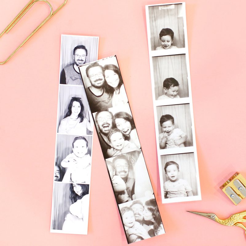 Photo strips sitting on pink desk