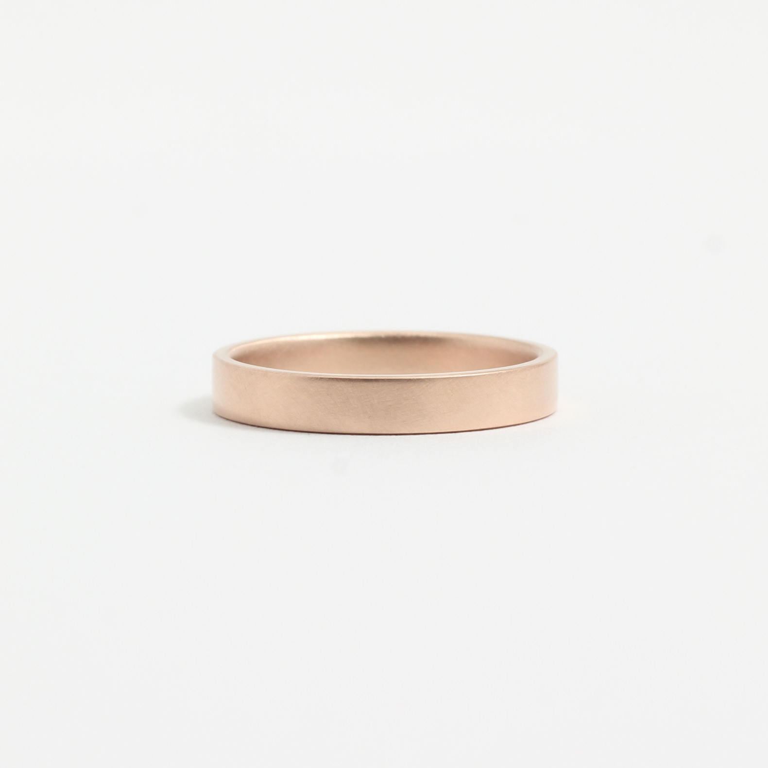 A gold wedding band from Good Gold