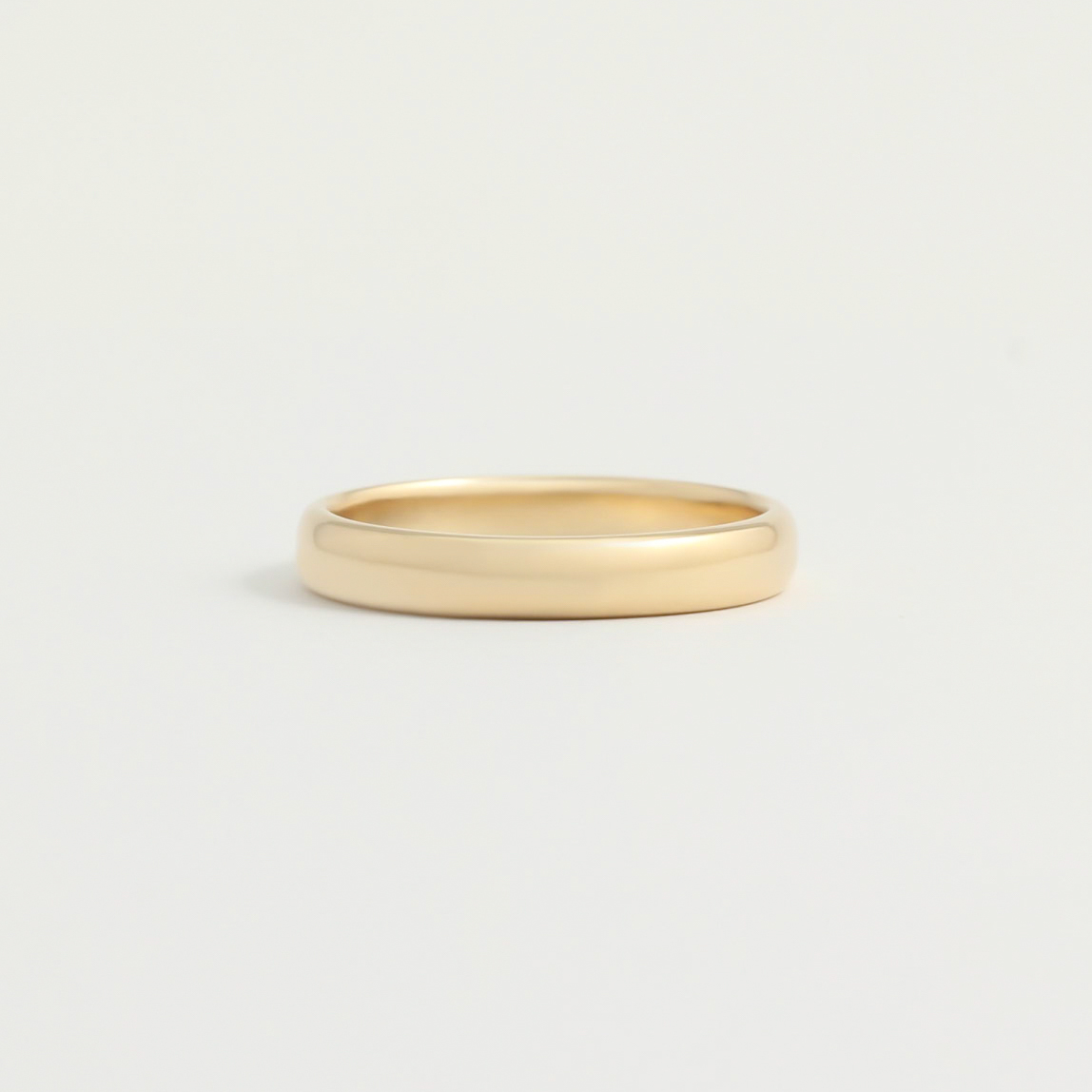 A gold wedding band from Good Gold