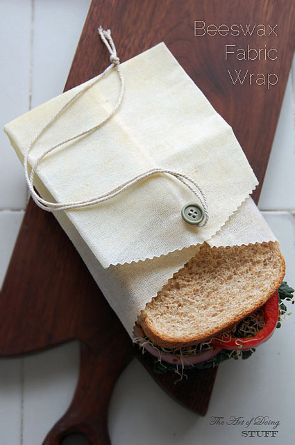 Buttoned beeswax pouch with a sandwich inside for bridal shower favors