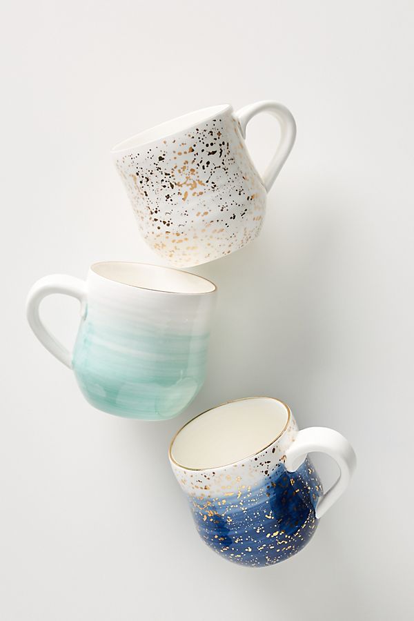 Three prettily painted mugs on a white background for bridal shower favors