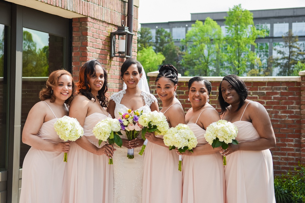 A bridal party poses together
