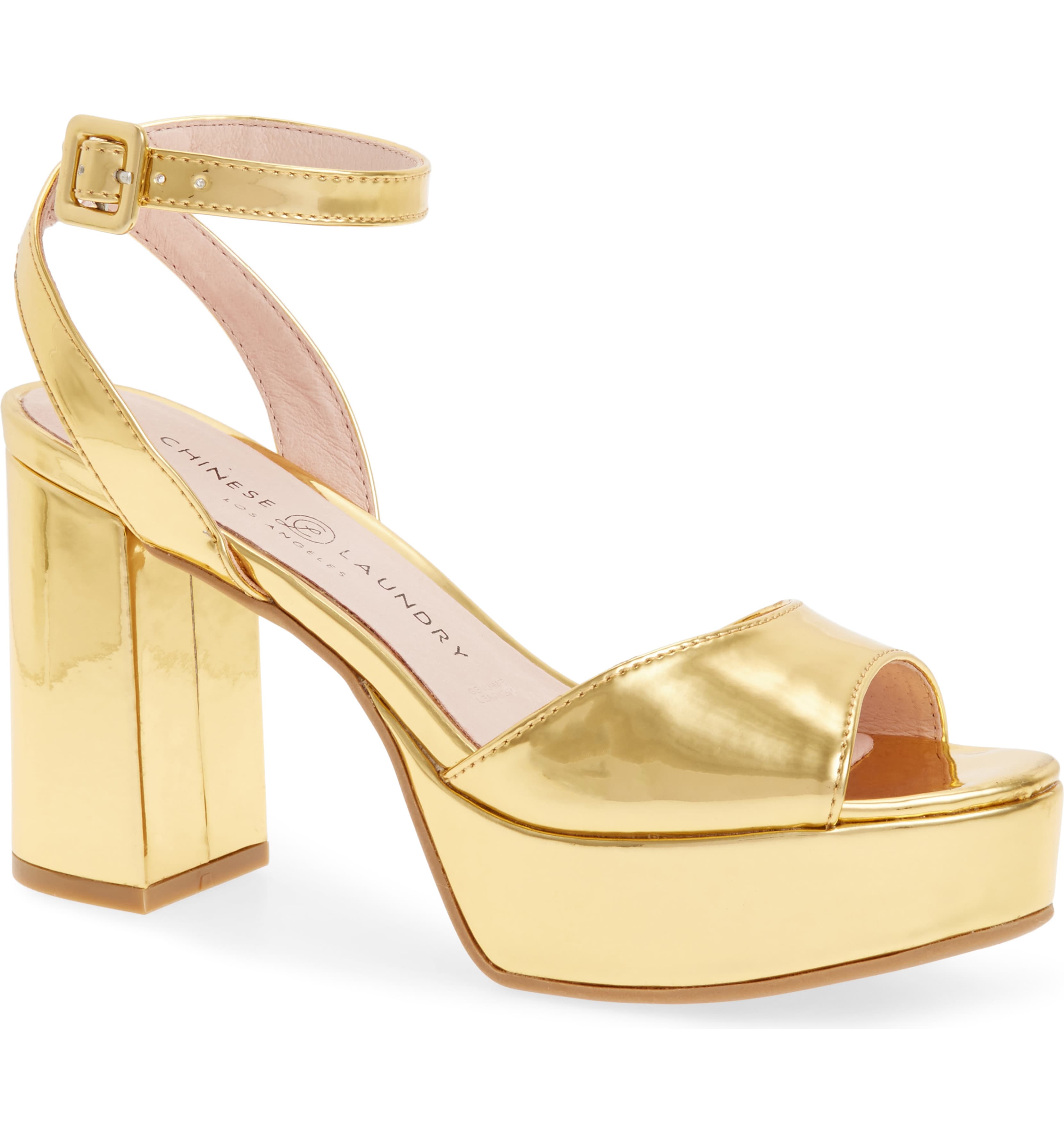 A gold colored platform shoe