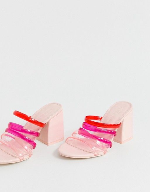 A pink sandal with red and hot pink straps