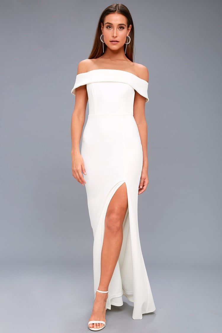 woman wearing an off the shoulder wedding dress with a thigh slit