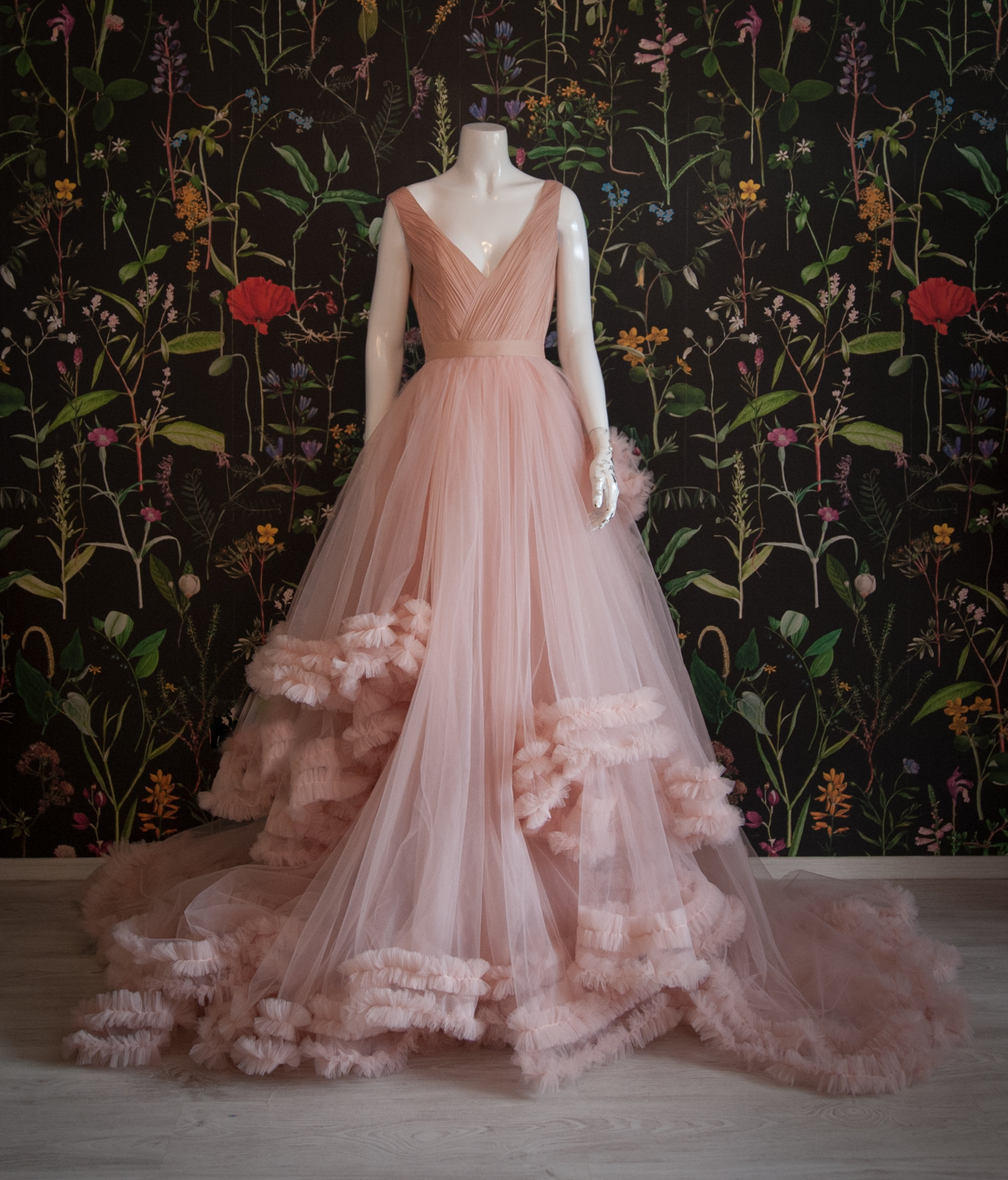 A dress with lots of tulle in a dark pink shade