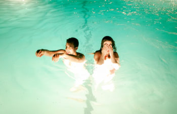 couple in the pool at The Ace Hotel Palm Springs