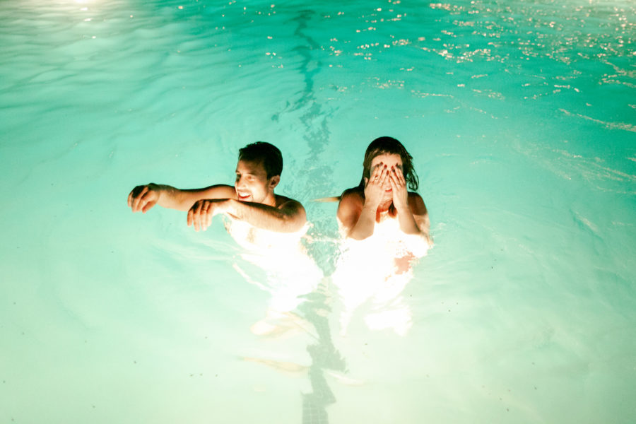 couple in the pool at The Ace Hotel Palm Springs