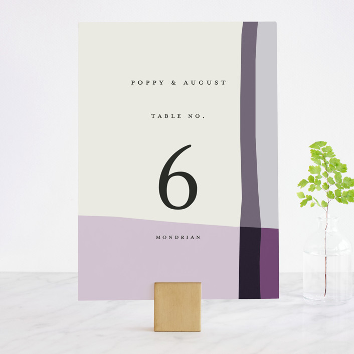 A table number identifier using fall wedding colors including purple