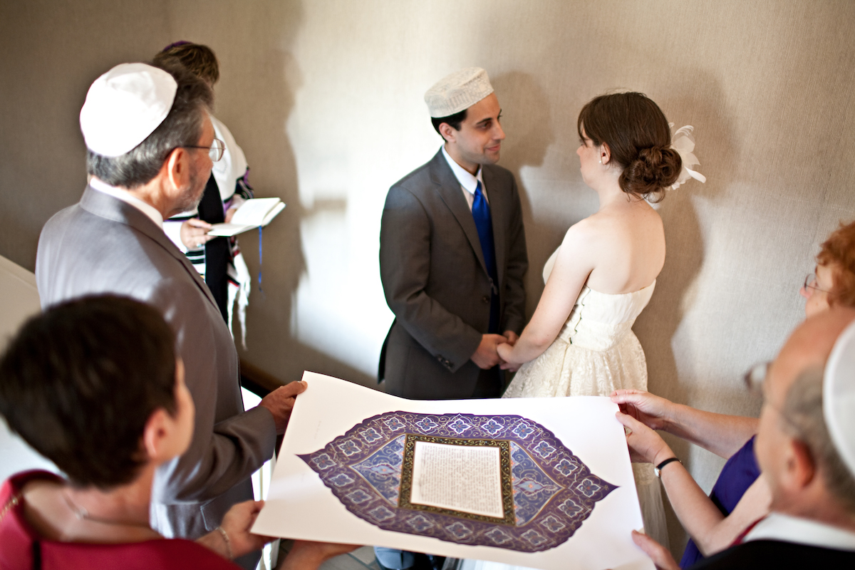 A Jewish couple during their wedding ceremony.