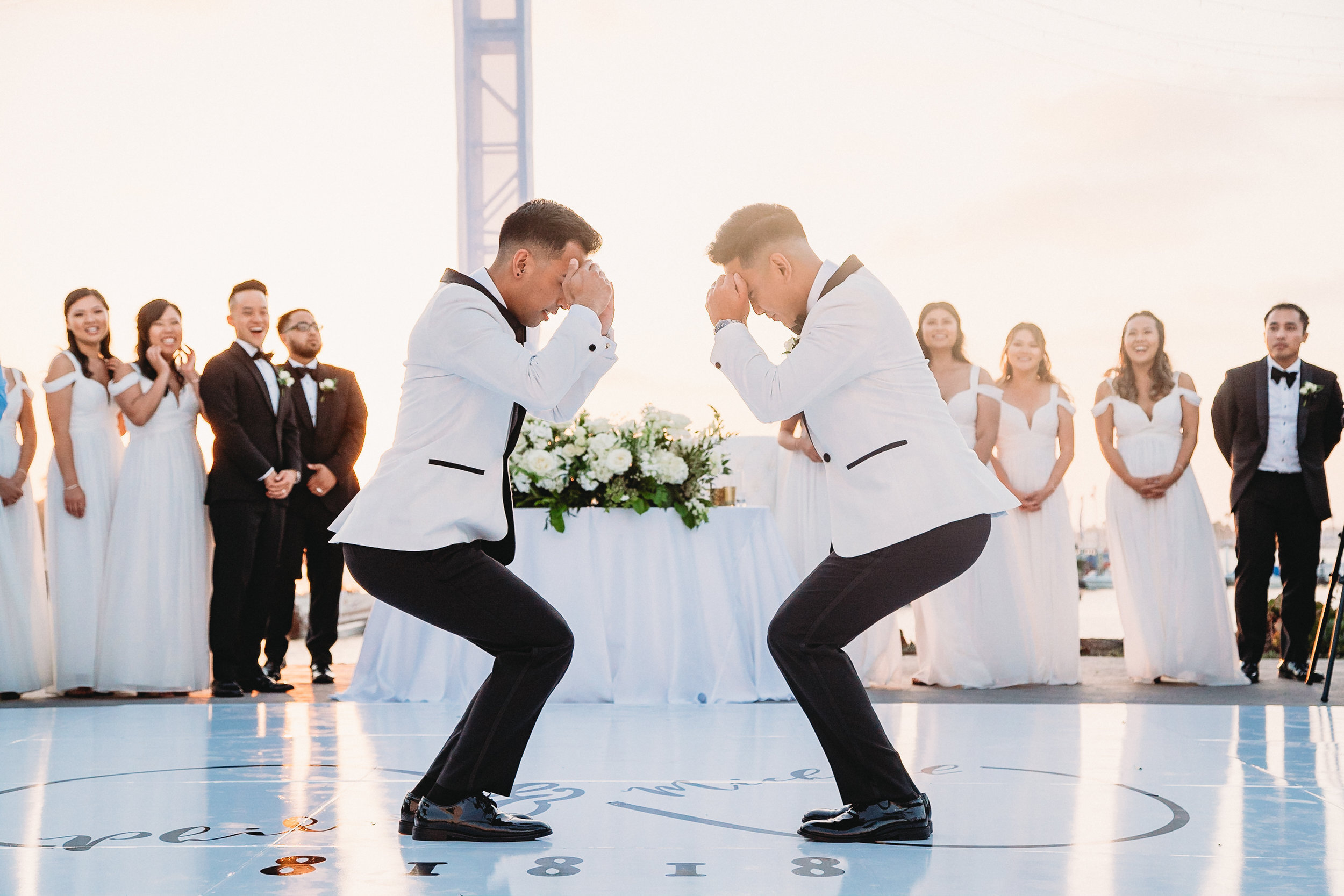 A wedding couple stand mid pose while dancing.