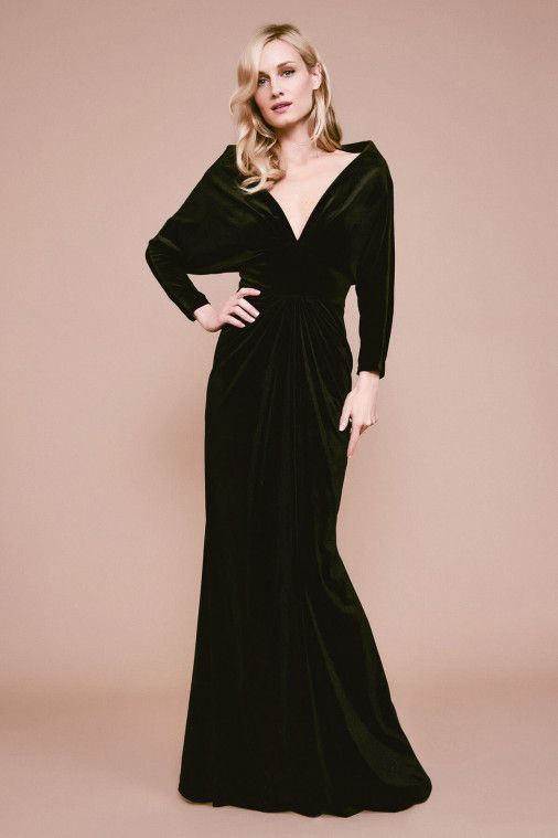 A woman wears a full sleeved gown with a v neck. Black wedding dresses.