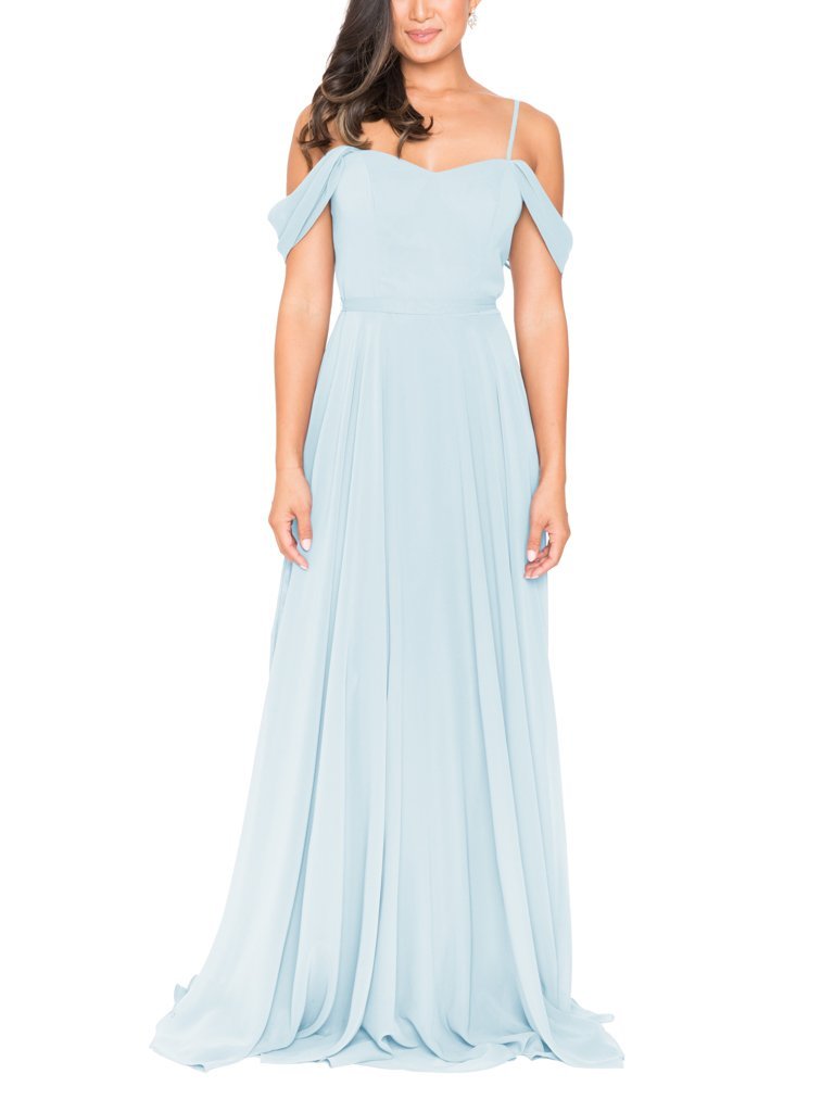 A woman wears a Brideside misty blue bridesmaid dressw.