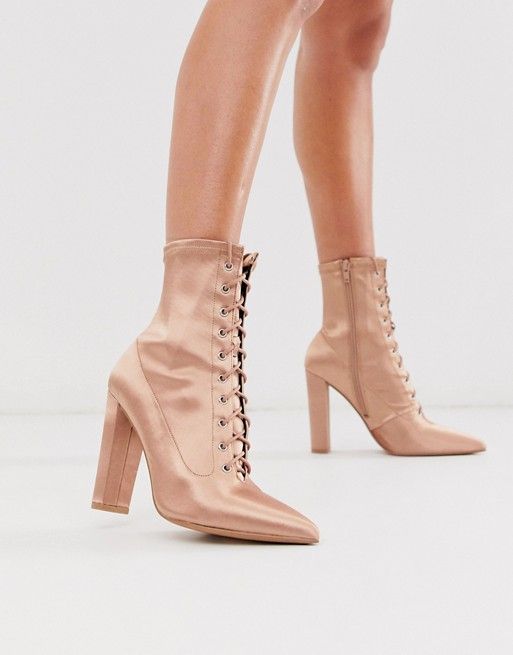 Lace up pink boots.