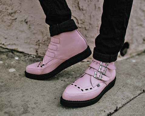 Pink boots with buckles.