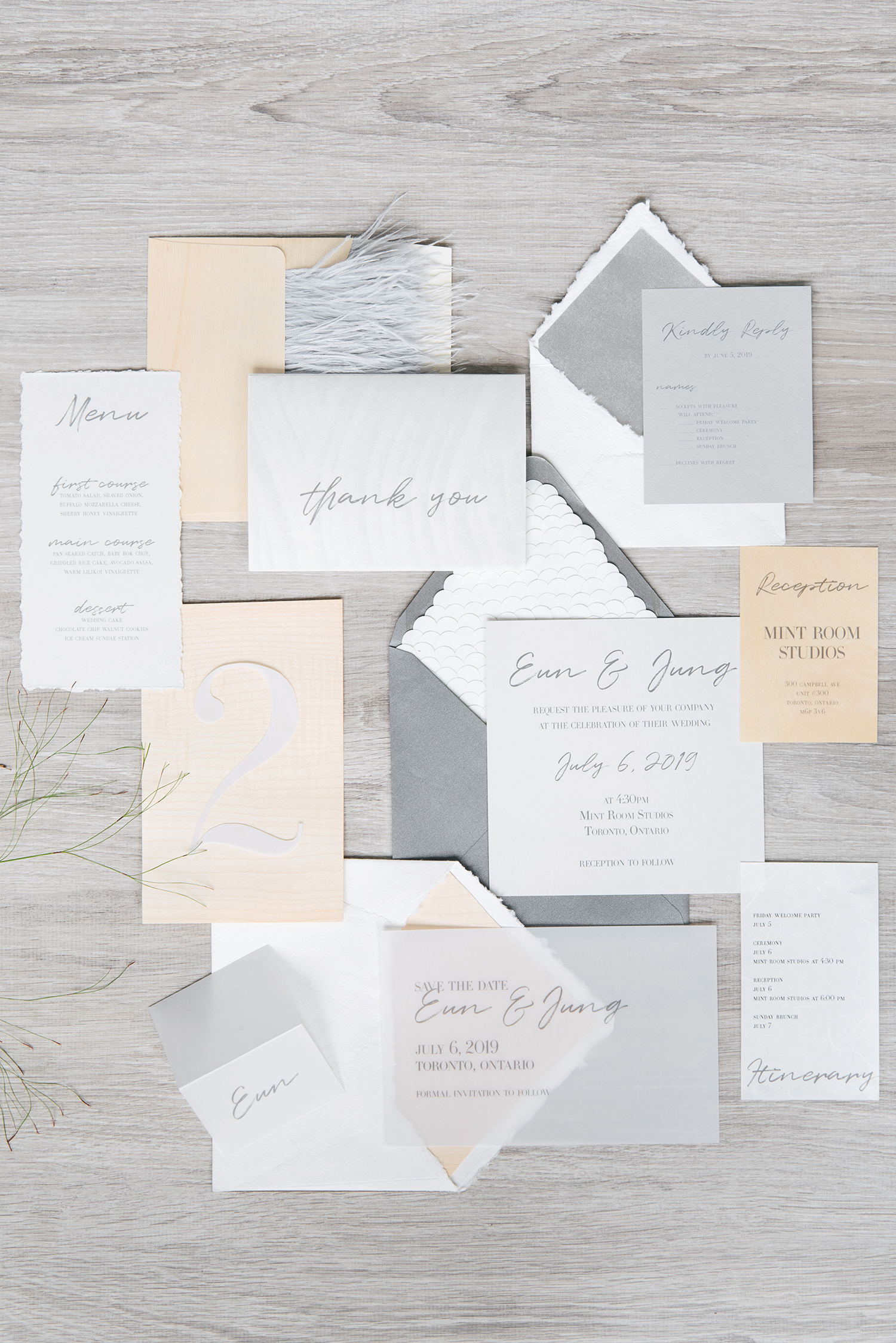 A full overhead layflat image of an invitation suite.