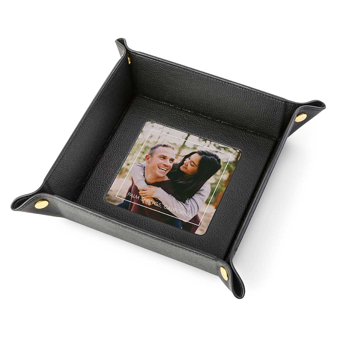 A leather plate with a photo embedded in the bottom.
