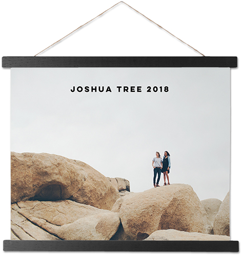 A hanging canvas print with people on rocks at Joshua Tree
