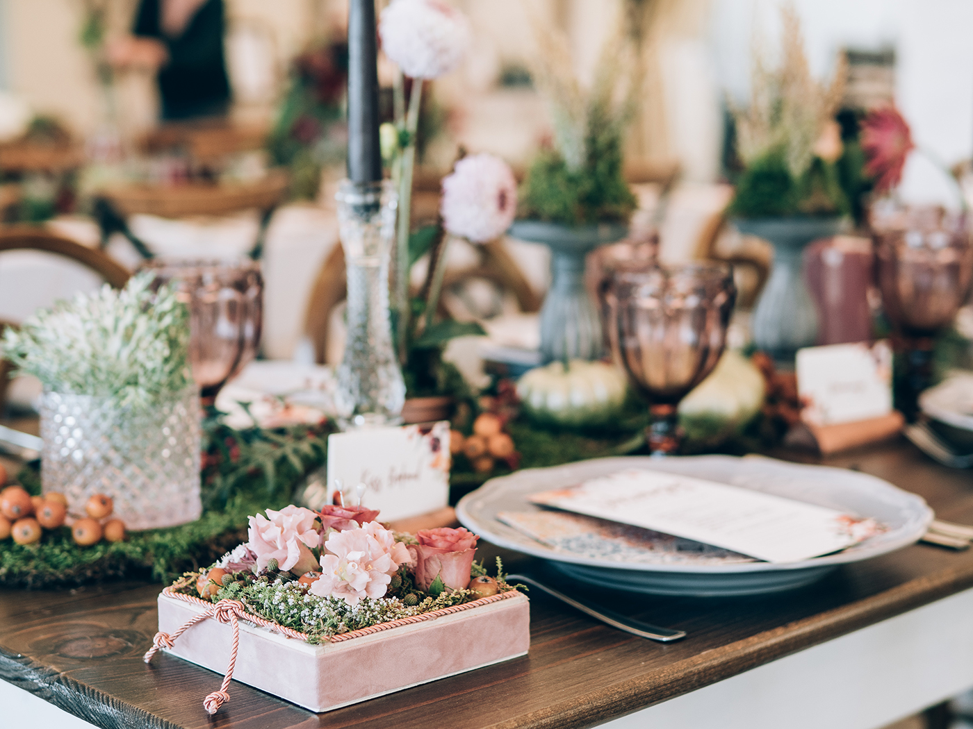 A wedding reception table decorated.