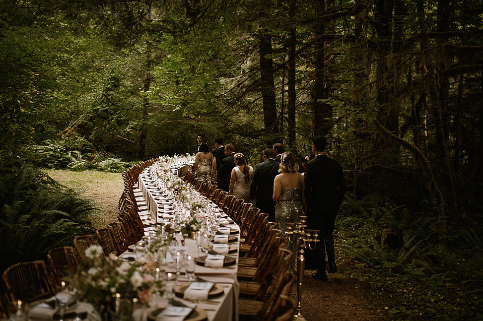 The longest wedding table in the world running through a forest.