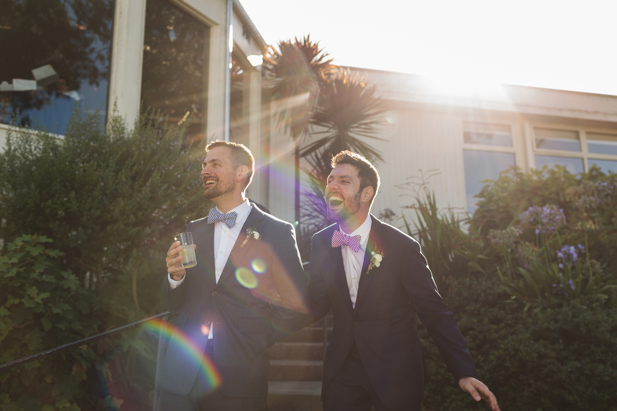 Two men smile on their wedding day.