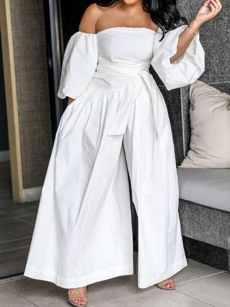 A strapless wedding jumpsuit with pleats and wide legs.