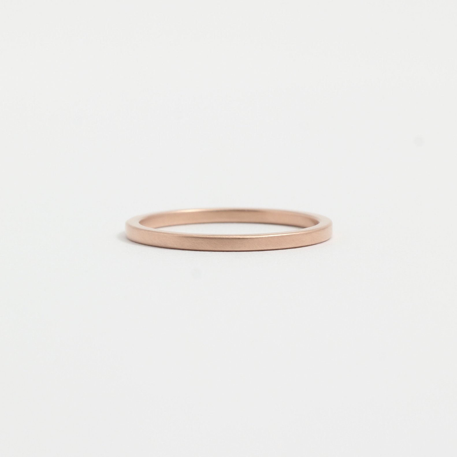 A simple gold wedding band.