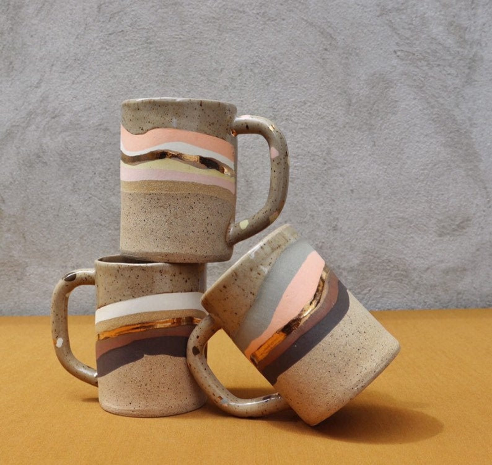 hand made and painted ceramic mugs