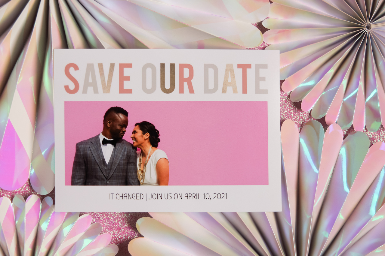 Wedding photo save the date on sparkly backdrop