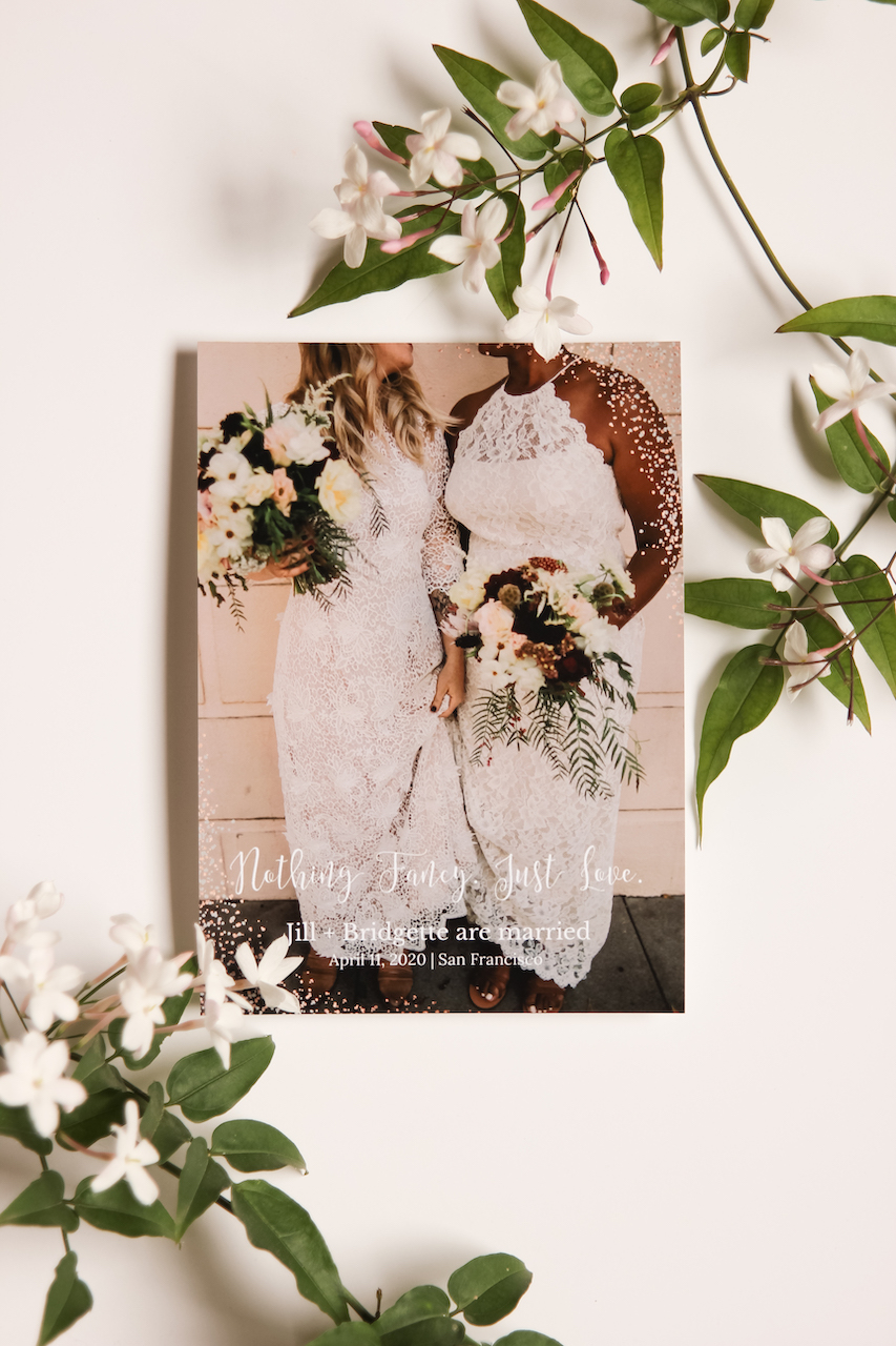 two brides on wedding invitation with flowers